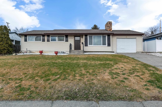 single story home featuring a front yard and a garage