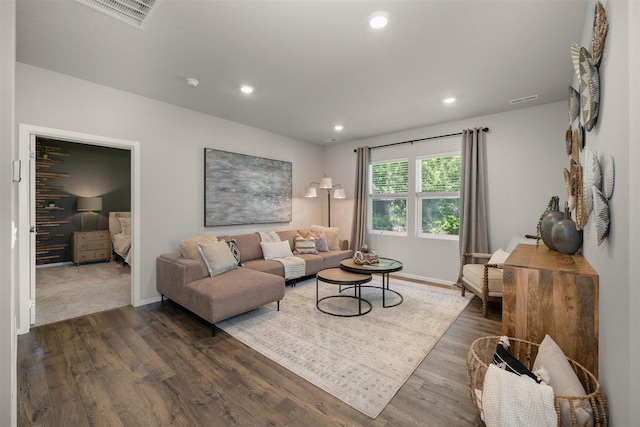 living room with dark hardwood / wood-style flooring