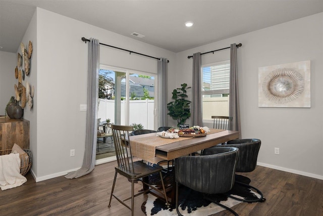 dining room with dark hardwood / wood-style flooring