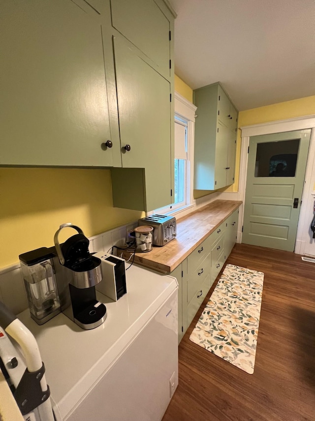 kitchen with butcher block countertops and dark wood-type flooring