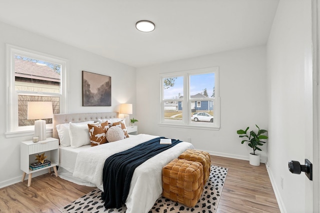 bedroom with light hardwood / wood-style flooring