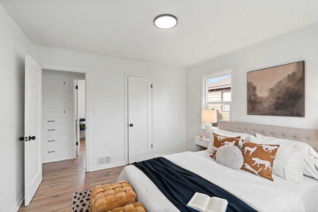 bedroom with light wood-type flooring