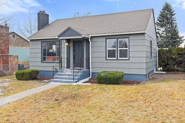 bungalow with a front lawn