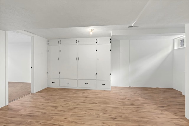 spare room featuring light hardwood / wood-style flooring