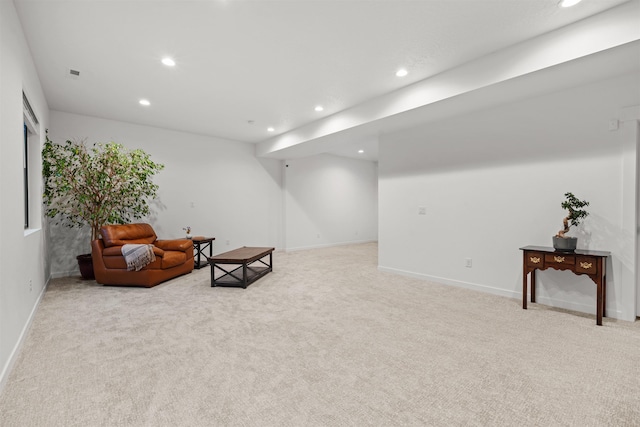 living area with light carpet