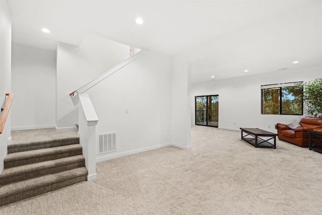 living room featuring light carpet