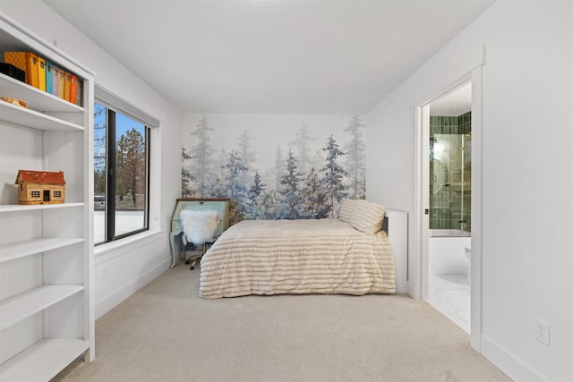 bedroom with ensuite bath, light colored carpet, and multiple windows