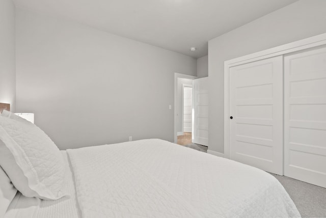 carpeted bedroom with a closet