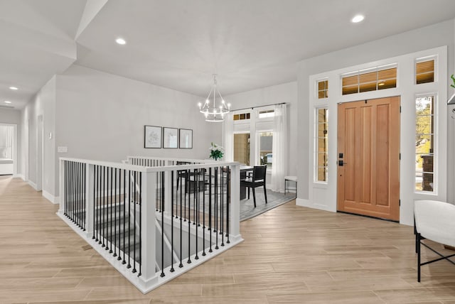 entrance foyer featuring an inviting chandelier