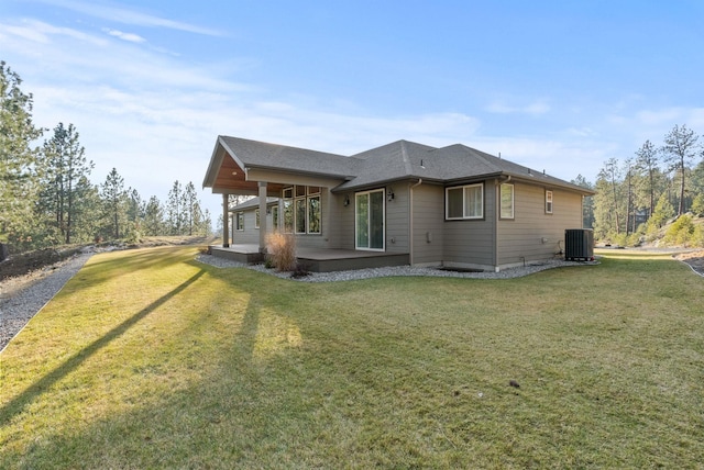 exterior space with cooling unit and a lawn