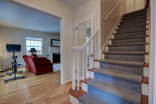 staircase featuring hardwood / wood-style flooring