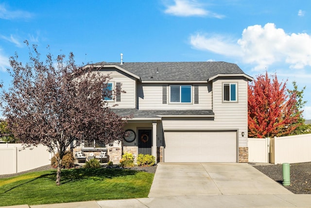 front facade with a garage and a front lawn