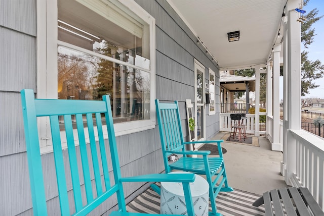 balcony featuring a porch