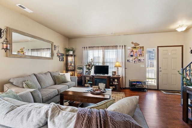 living room with dark wood-type flooring