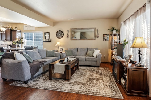 living room with dark hardwood / wood-style flooring