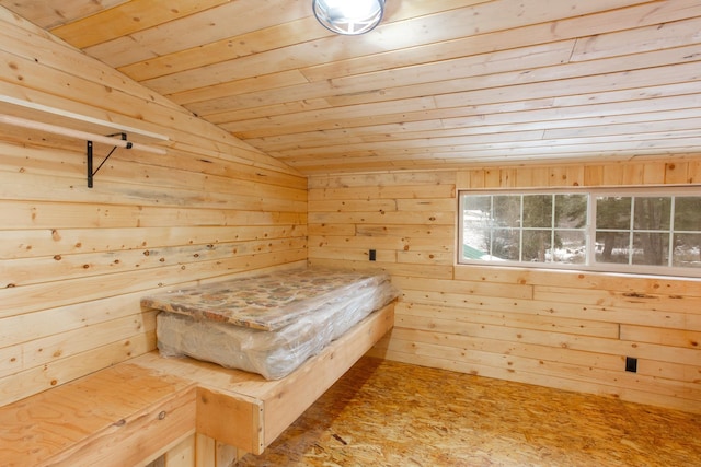 unfurnished bedroom featuring vaulted ceiling, wood ceiling, and wood walls