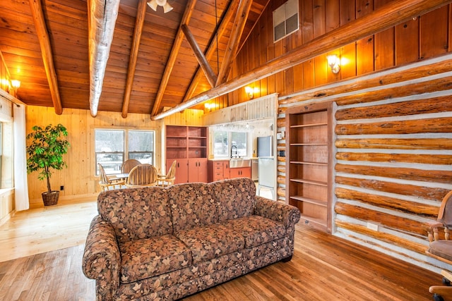 living room with sink, beamed ceiling, light hardwood / wood-style flooring, wood ceiling, and high vaulted ceiling