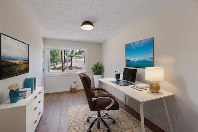 office with a textured ceiling and hardwood / wood-style flooring