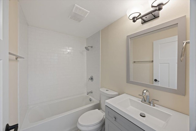 full bathroom with toilet, tiled shower / bath combo, and vanity