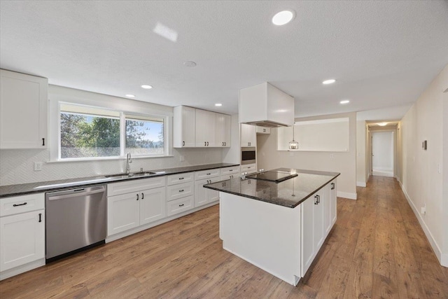 kitchen with sink, white cabinets, and dishwasher