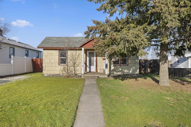 view of front of home with a front yard