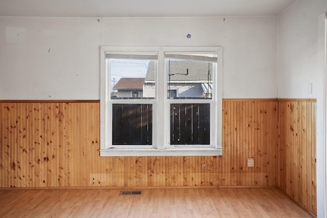 empty room with hardwood / wood-style floors