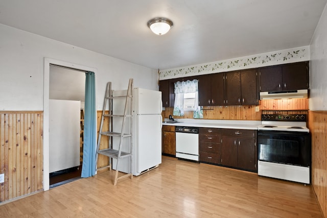 kitchen with white appliances, dark brown cabinets, and light wood-type flooring