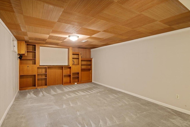 home theater room with crown molding and carpet flooring