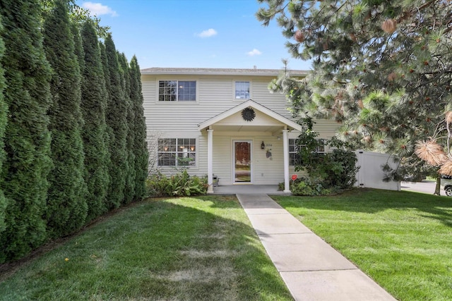 view of front of property with a front lawn