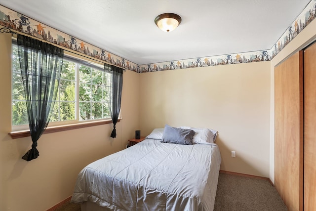 bedroom with a closet and carpet flooring