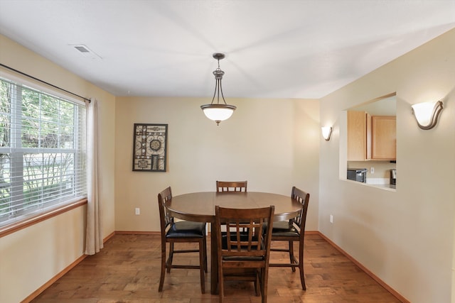 dining area with hardwood / wood-style flooring