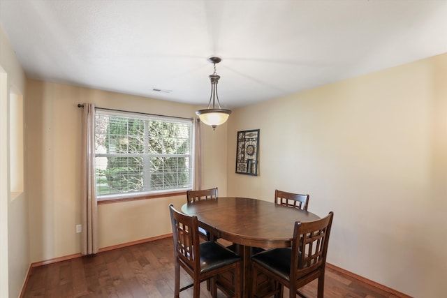 dining room featuring dark hardwood / wood-style flooring