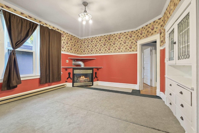 unfurnished living room featuring a baseboard heating unit, a notable chandelier, ornamental molding, and carpet flooring