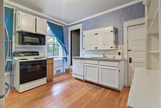 kitchen featuring sink, white appliances, white cabinets, and light wood-type flooring