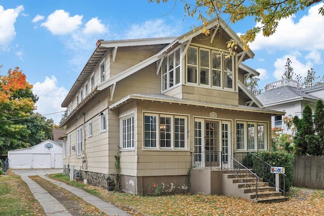 view of front facade with an outdoor structure and a garage