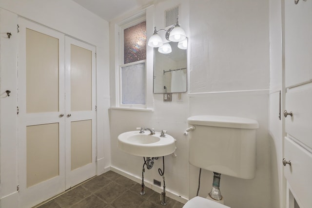 bathroom with toilet and sink