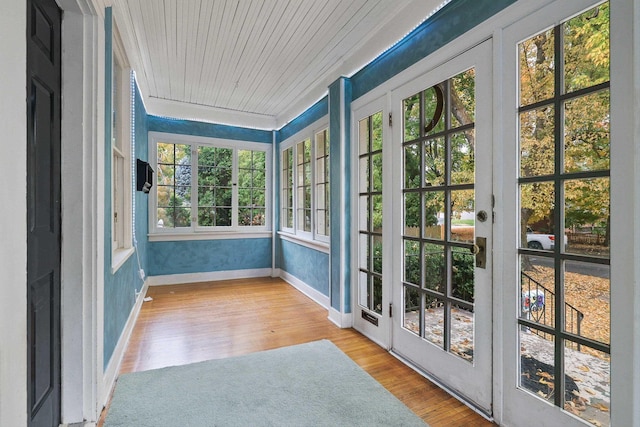 unfurnished sunroom with wood ceiling