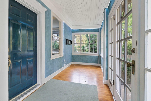 unfurnished sunroom featuring wooden ceiling