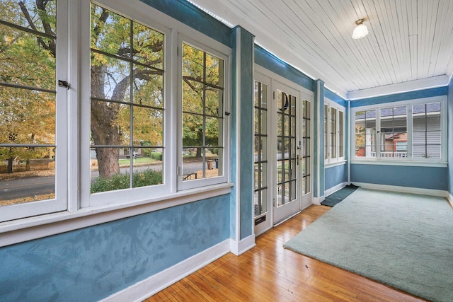 doorway with hardwood / wood-style flooring and wood ceiling