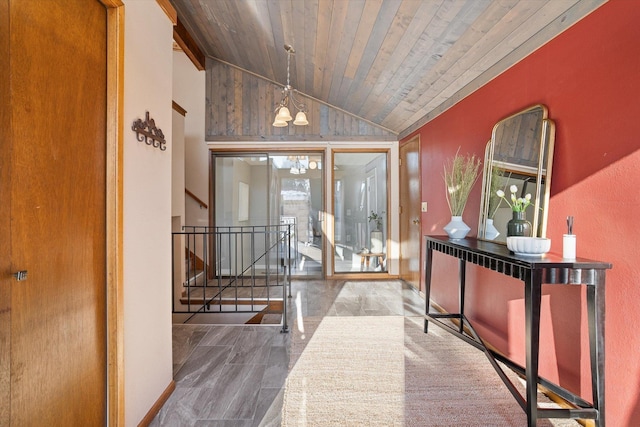 interior space with a chandelier, lofted ceiling, and wood ceiling