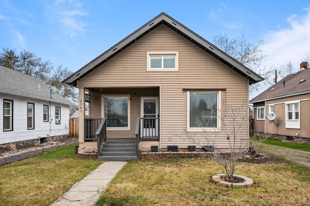 bungalow-style house featuring a front yard and a porch