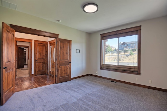 unfurnished bedroom featuring carpet