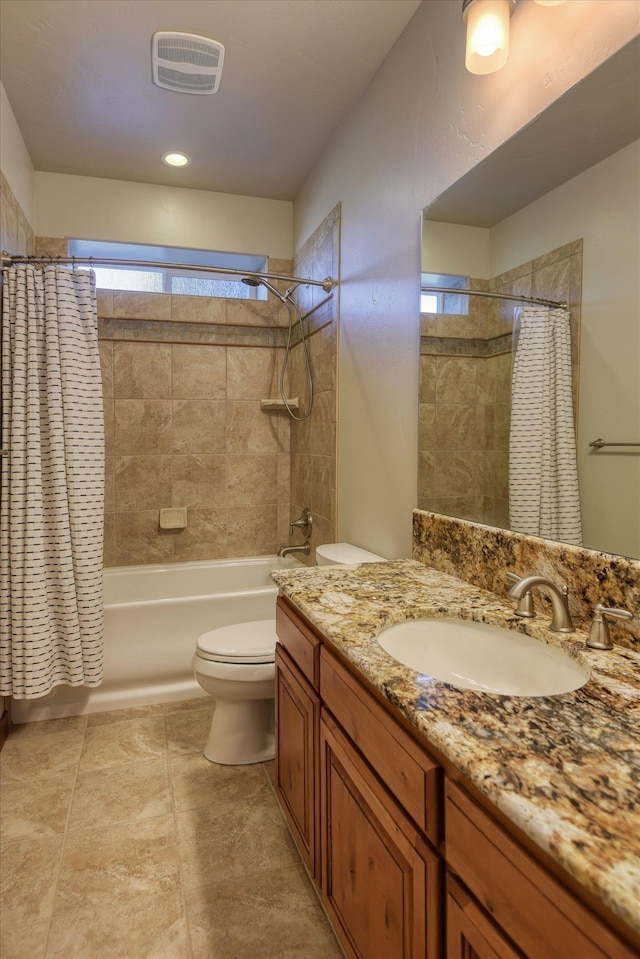 full bathroom featuring toilet, vanity, and shower / bath combination with curtain