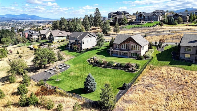 birds eye view of property featuring a mountain view