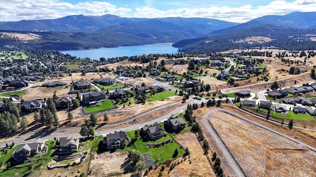 bird's eye view featuring a water and mountain view