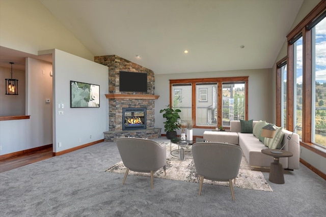 carpeted living room with high vaulted ceiling and a stone fireplace