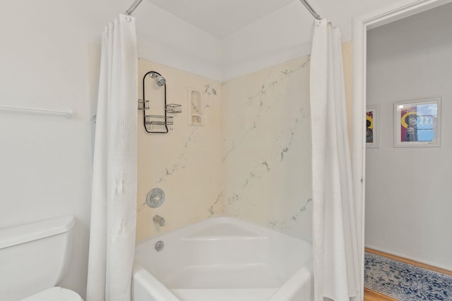 bathroom featuring wood-type flooring, toilet, and shower / tub combo with curtain