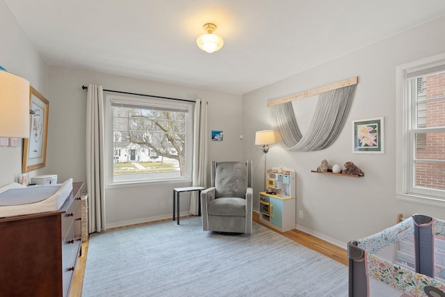 sitting room with light hardwood / wood-style floors