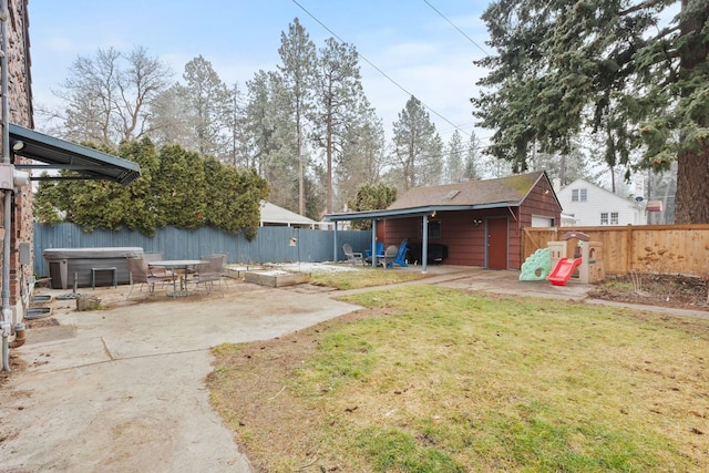 view of yard with a hot tub and a patio