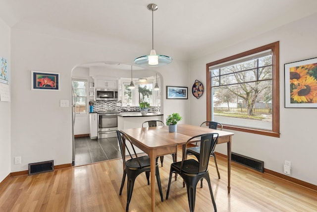 dining room with light hardwood / wood-style floors